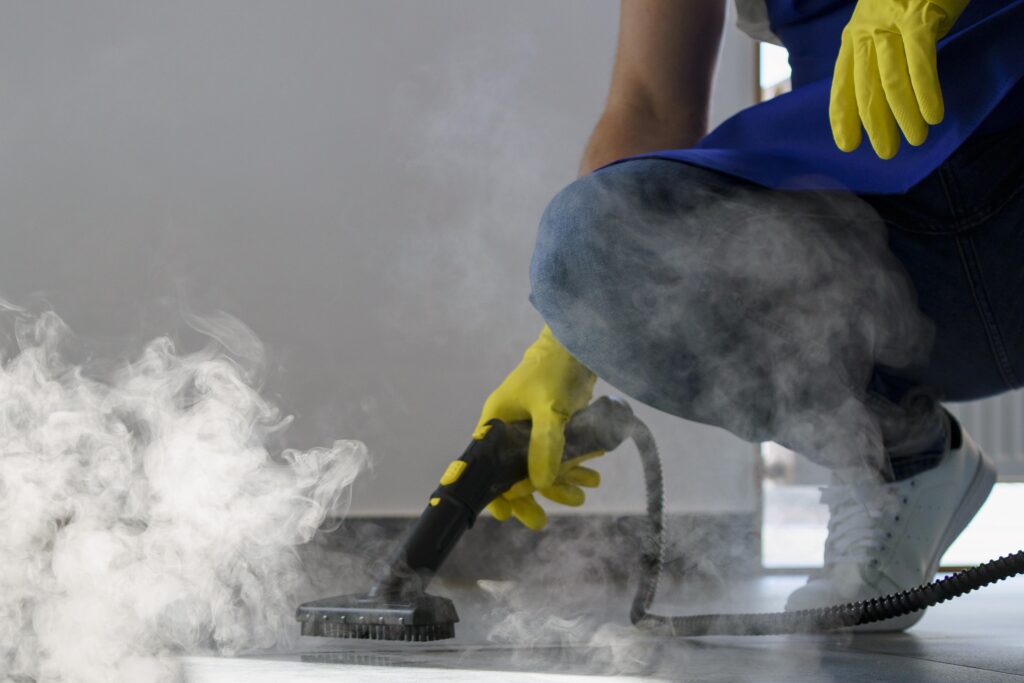 professional-cleaning-service-person-using-steam-cleaner-office-min